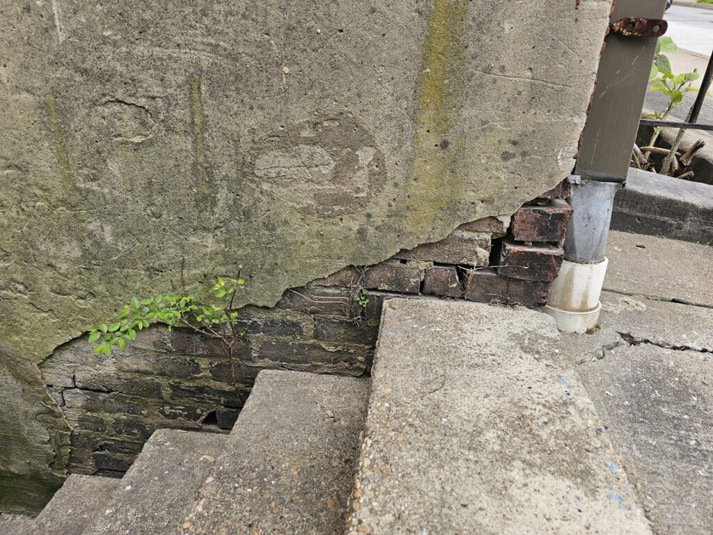 parge cement or stucco coat - Base Wall Deterioration