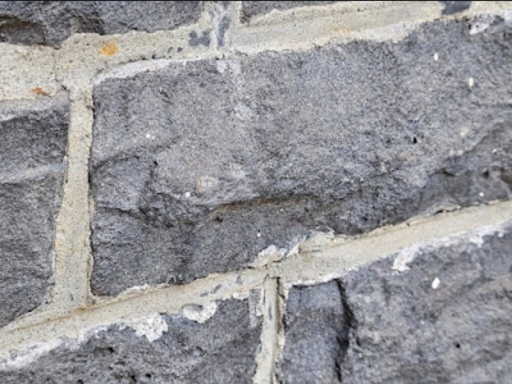 mortar remnants on the stone surface