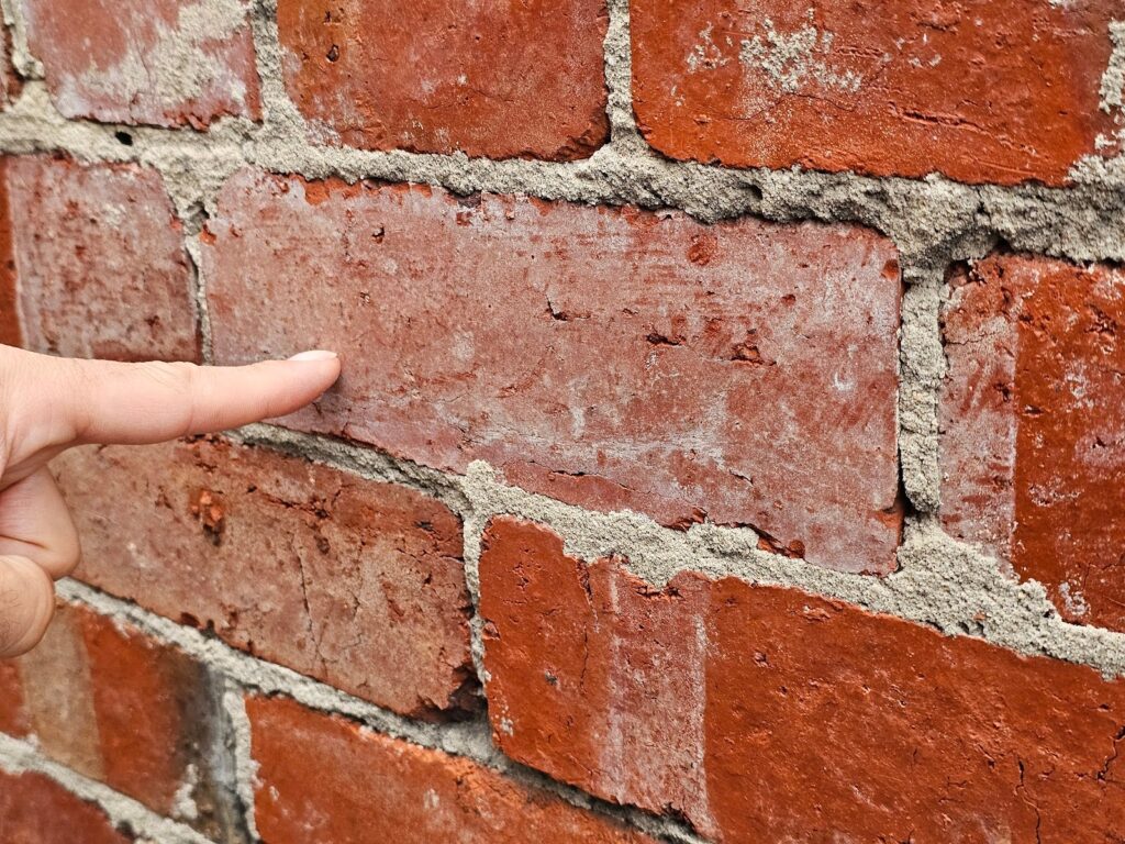 The mortar joints at this particular area of the wall