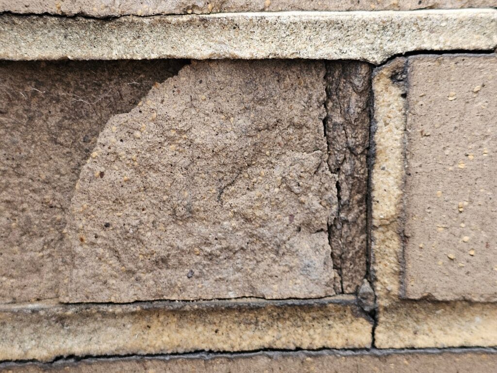 same part of a remaining portion of a damaged brick