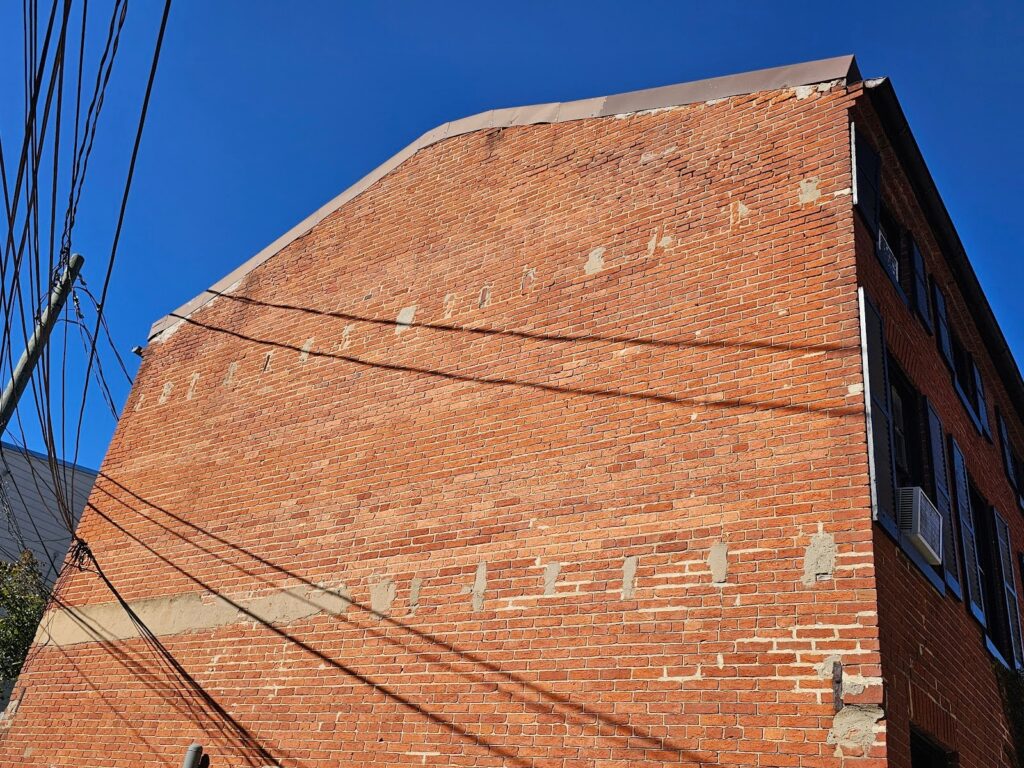 Beam pockets Abandoned in a Historic Brick Wall