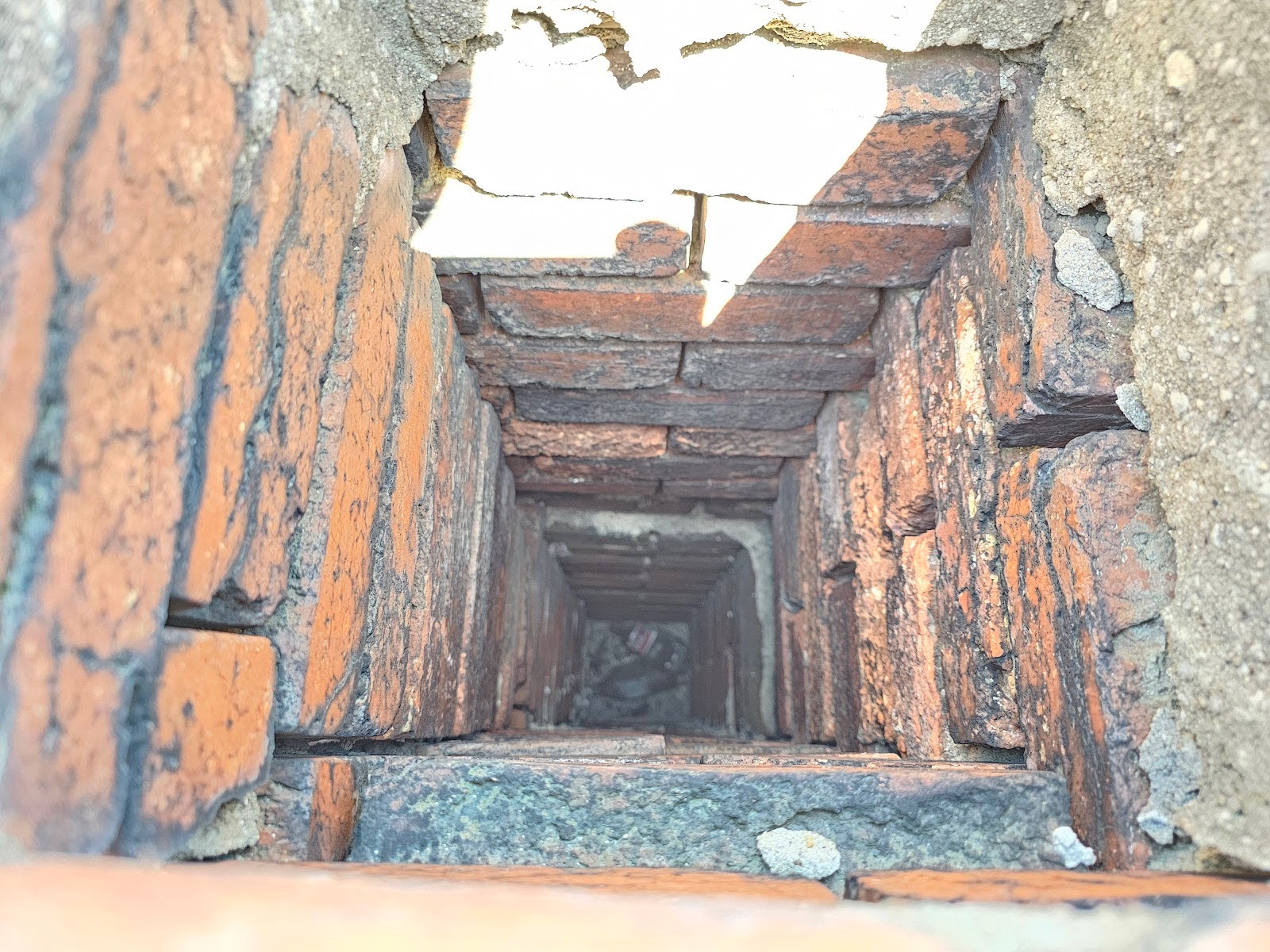 down into the inside of an uncapped chimney.