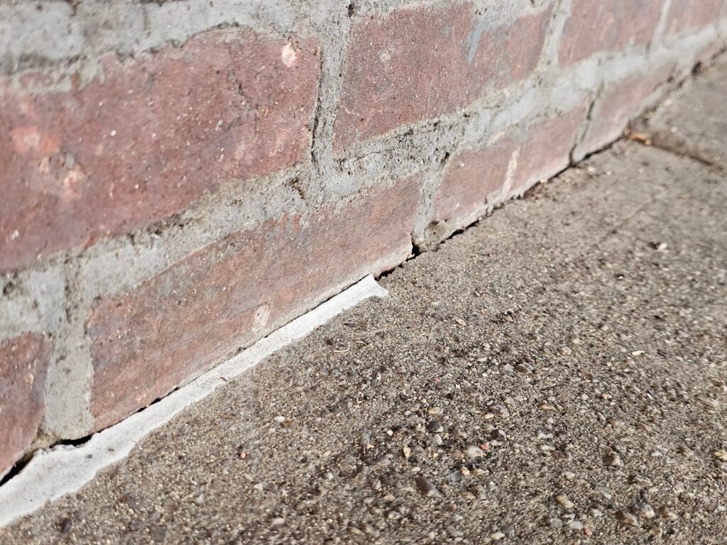 the brick wall which will lead to cracking