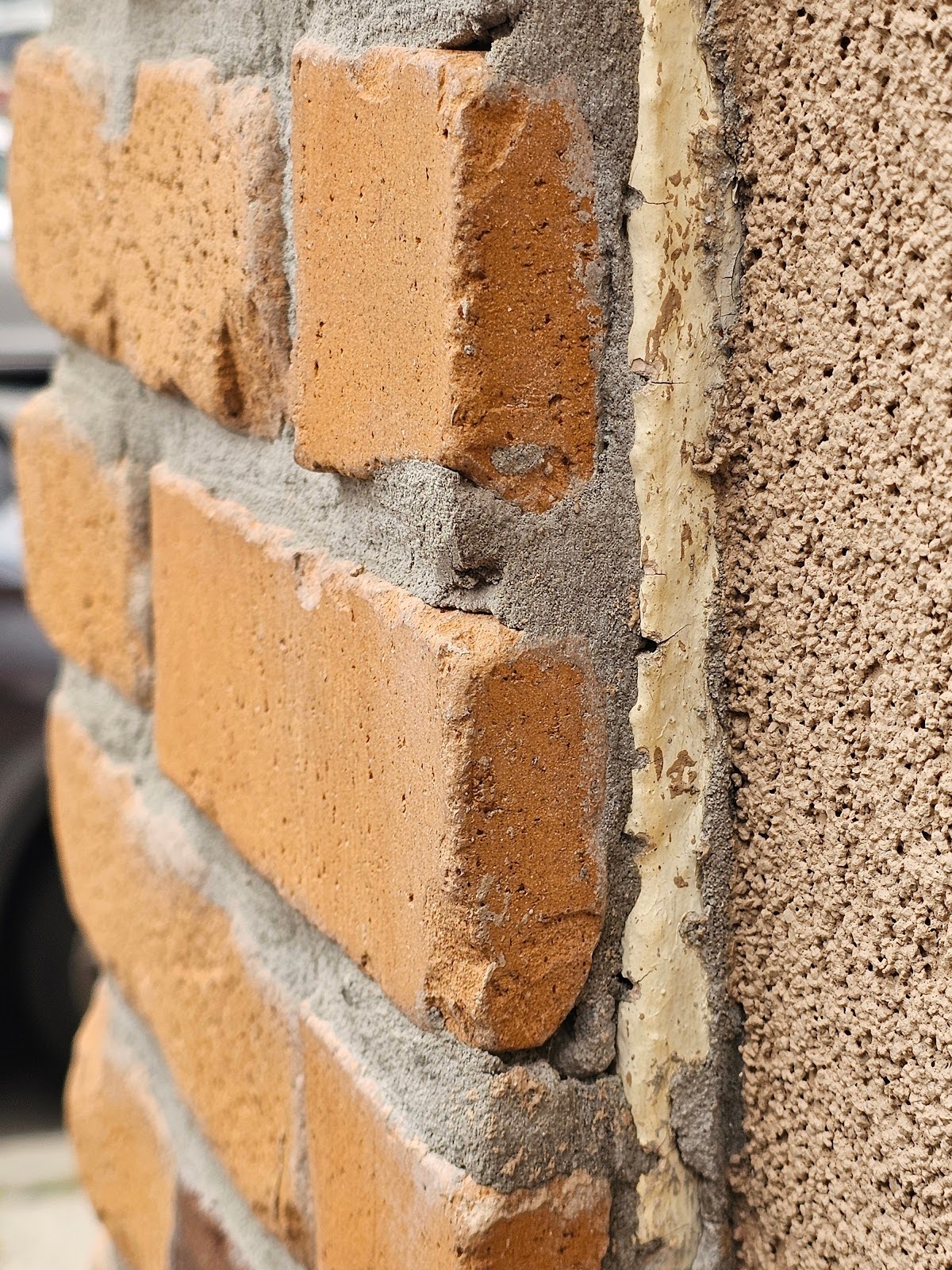 the back edge of the bricks at the corner