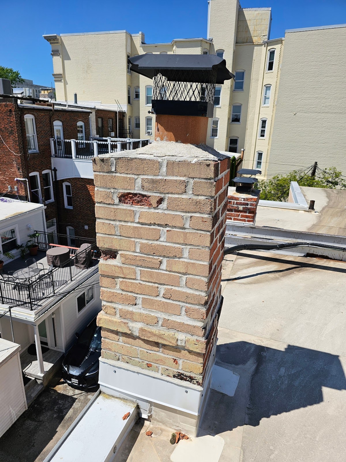 Brick Chimneys Above Rooftops