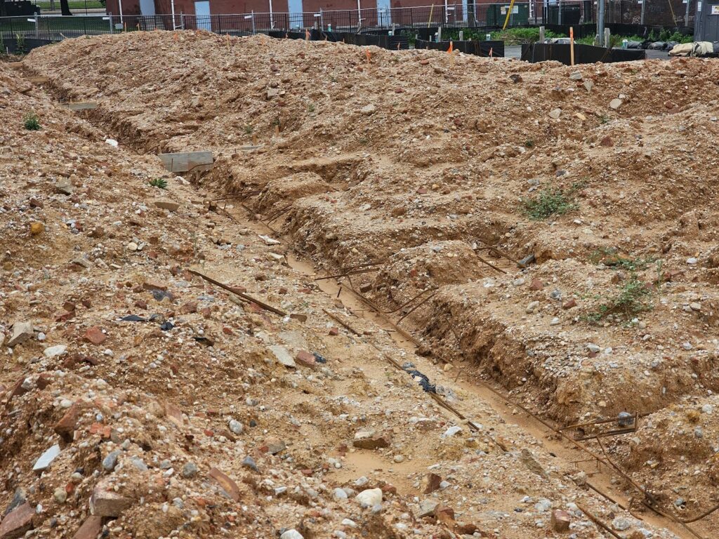 historic formerly standing buildings litter the dirt