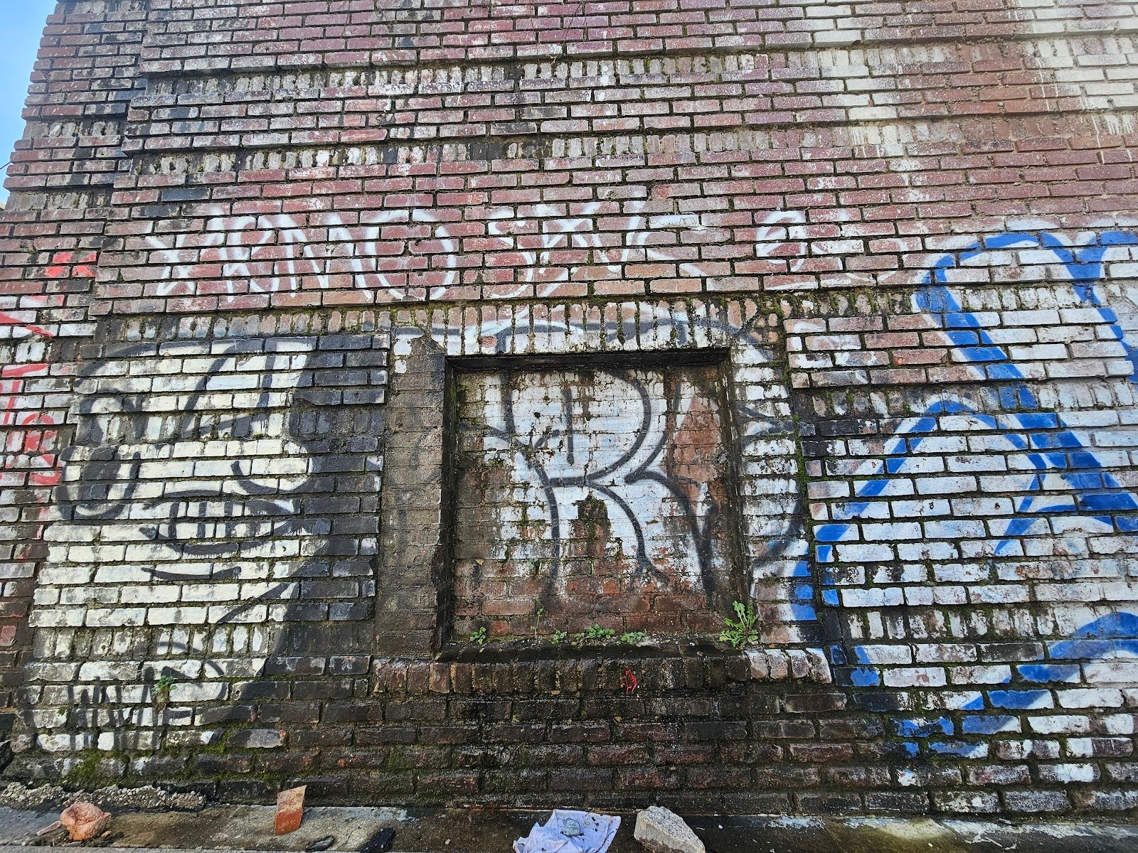 Close-up of masonry deterioration from leaking gutter in DC property