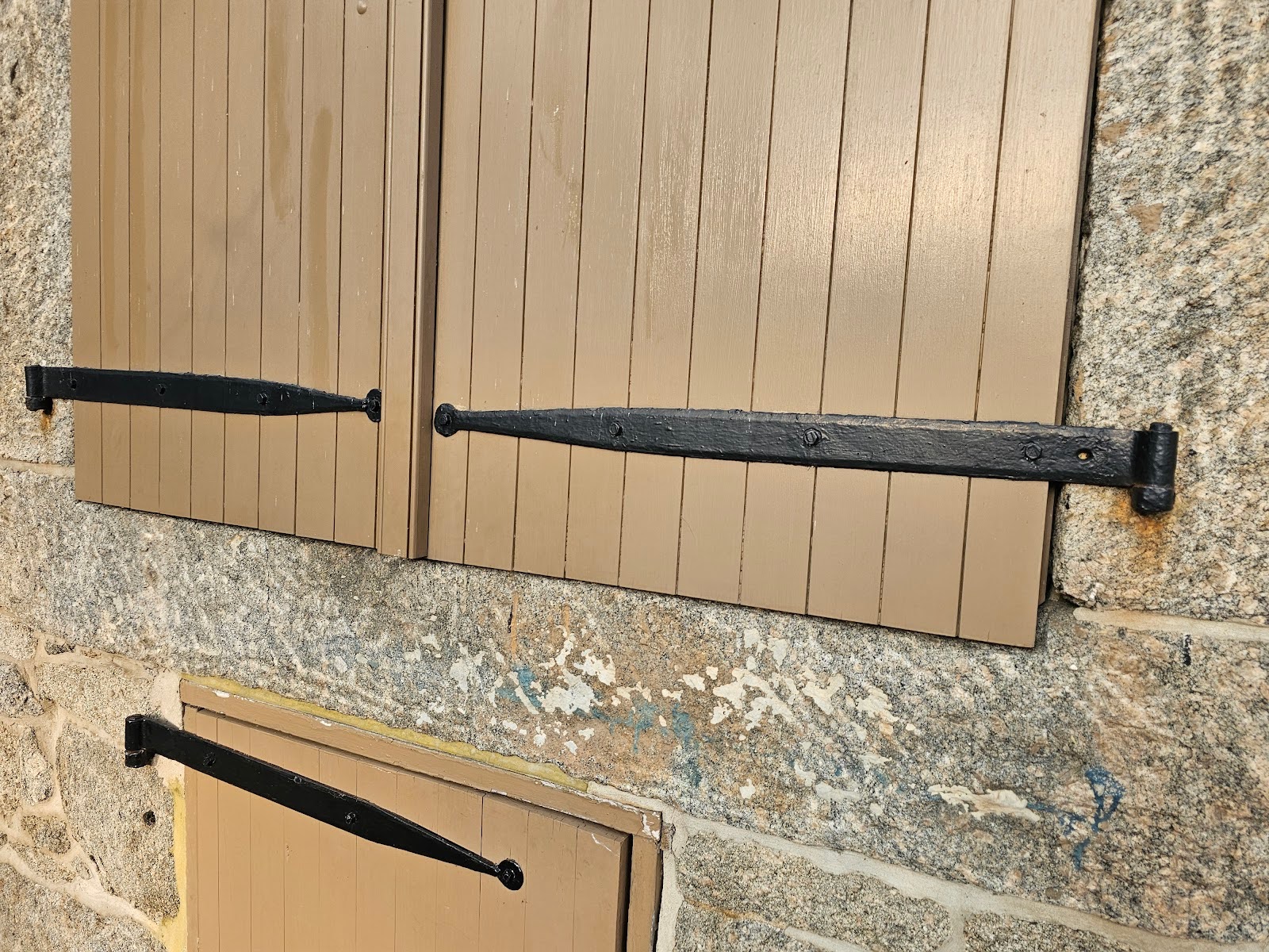 Traditional strap hinges in historic masonry restoration