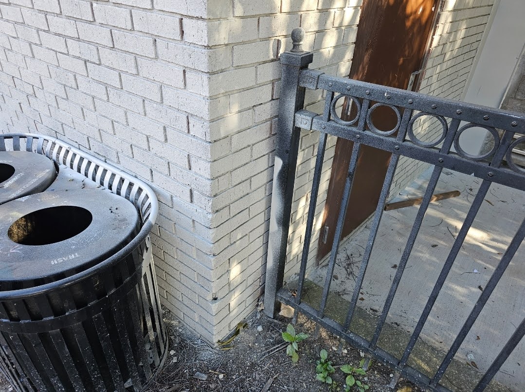 Completed painted brick facade showing clean lines after masking removal