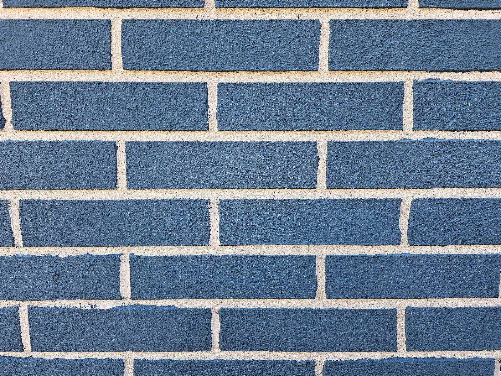 Exterior wall showcasing Painted Brick Faces and natural mortar lines