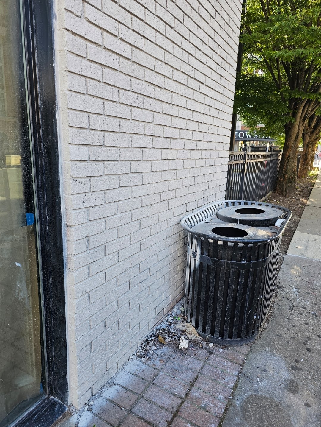 Masking process to protect painted brick facade during painting
