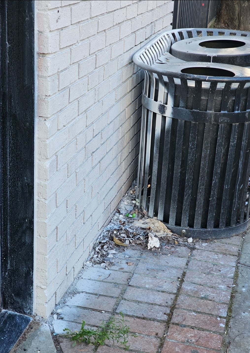 Masking tape applied to protect adjacent surfaces before painting brick wall