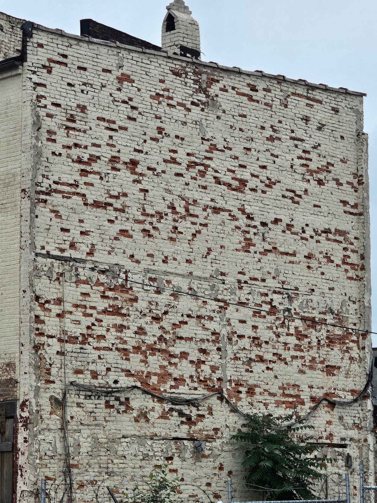 Close-up view of extreme brick spalling damage