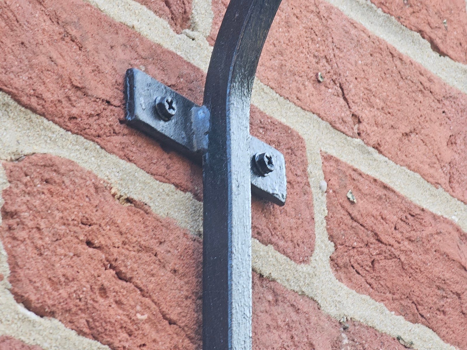 Exterior brick wall decorations with vintage-style wall hangings