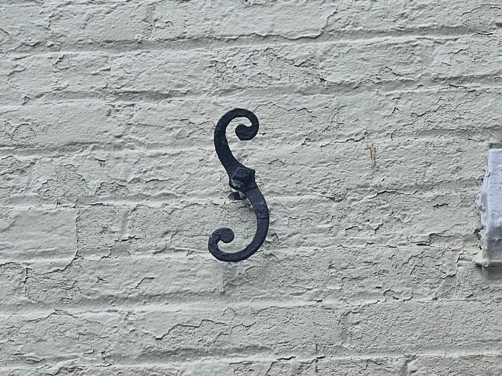 A close-up view of one of the shutter dogs