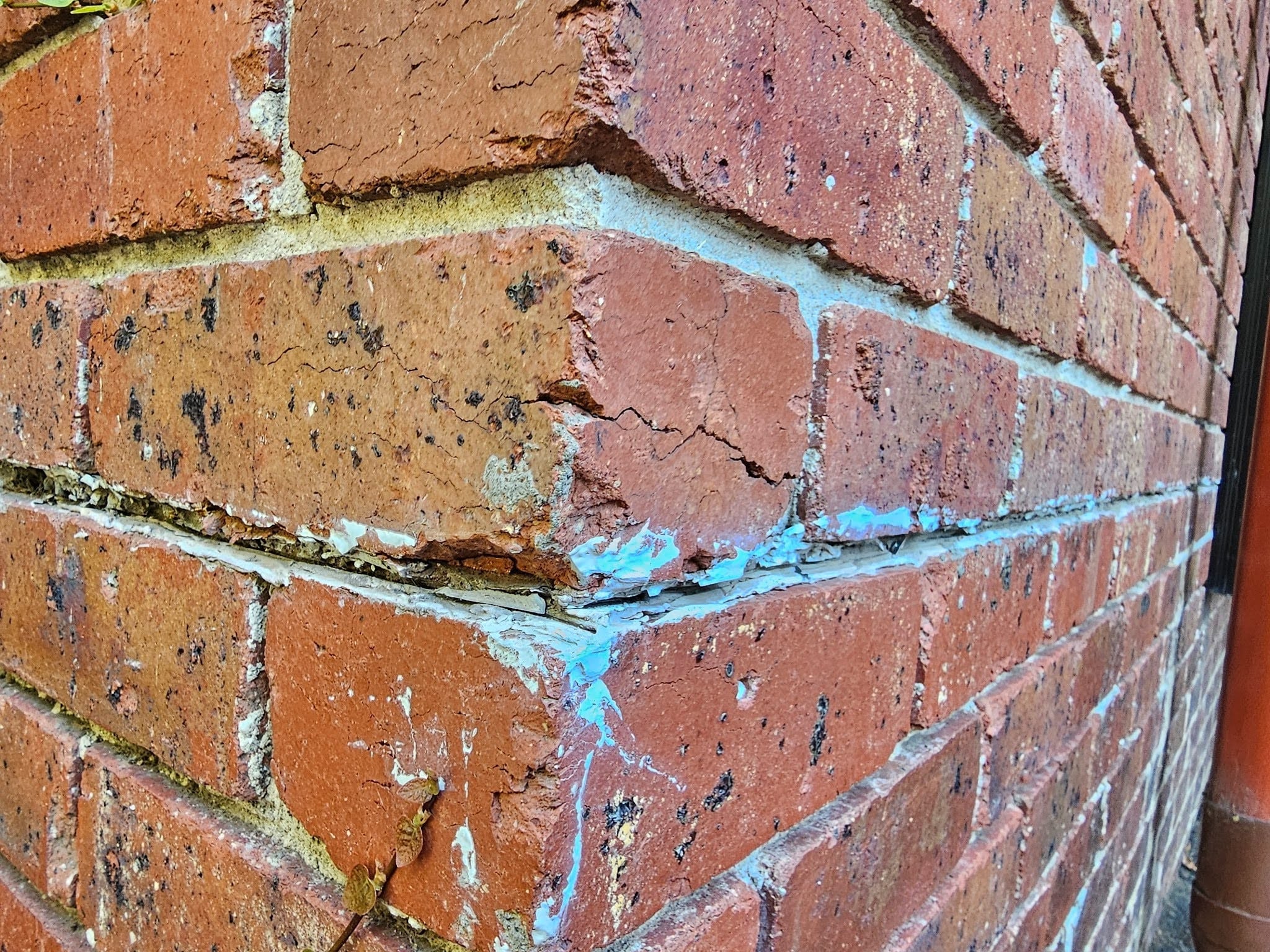Brick facade hanging on the superstructure