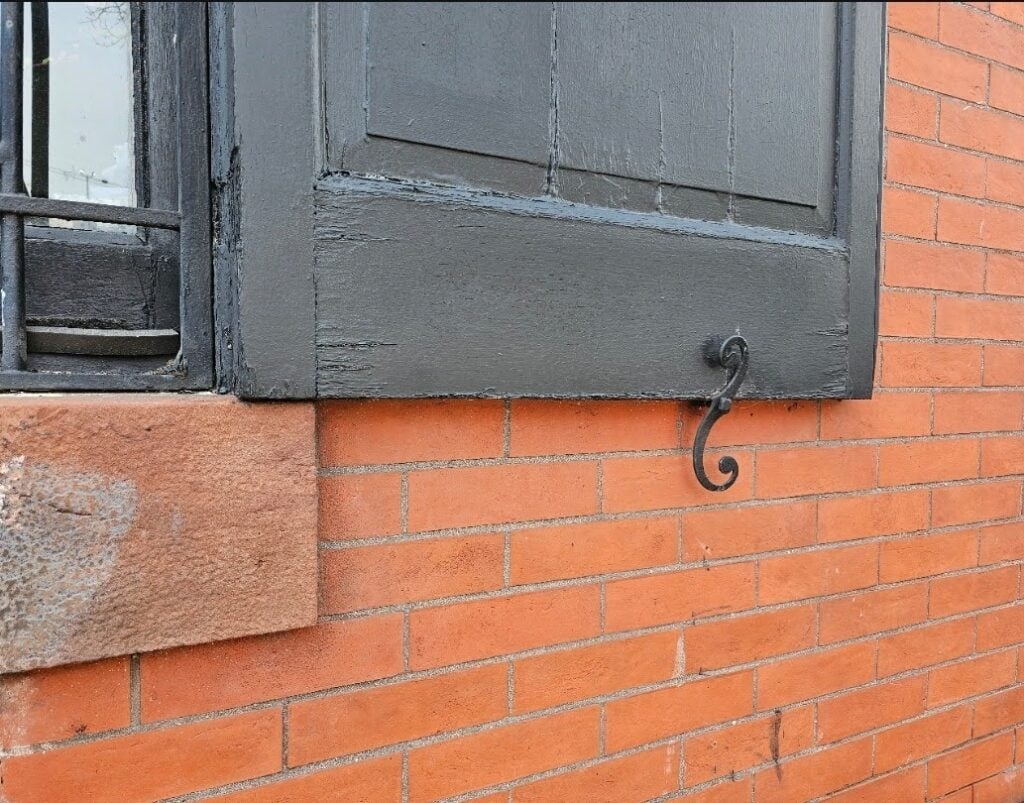 spacing being used for the actual purpose of keeping the shutter in place