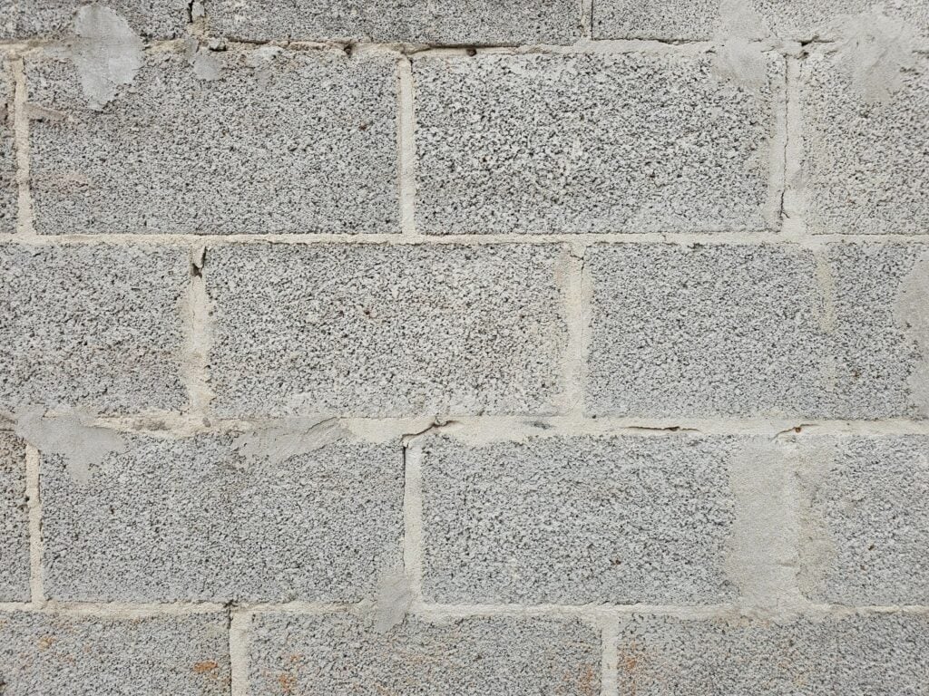 Brick to block wall union with properly installed metal flashing to prevent water intrusion in Washington, DC