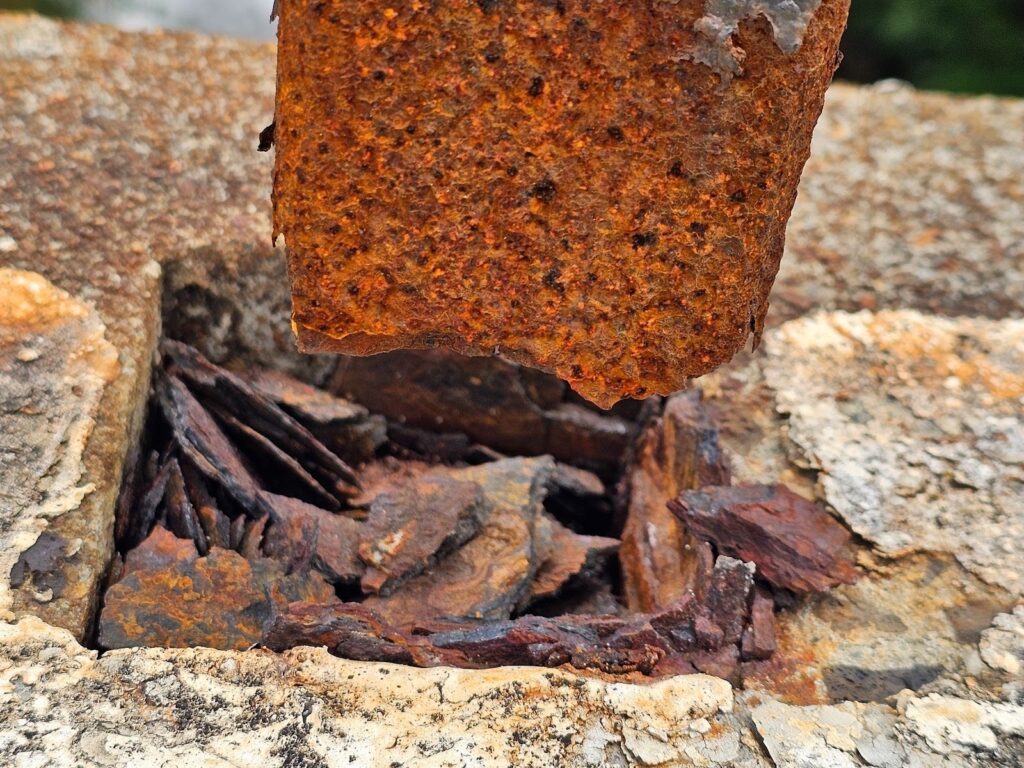 Masonry and concrete construction with exposed steel embeds